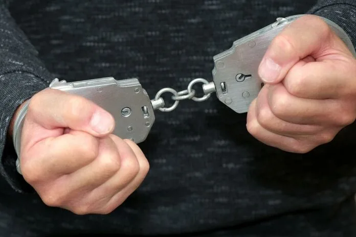Two people suspected of breaking glass and stealing items from a building owned by a company